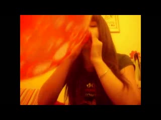 cute girl blows up a big and pretty balloon until it pops